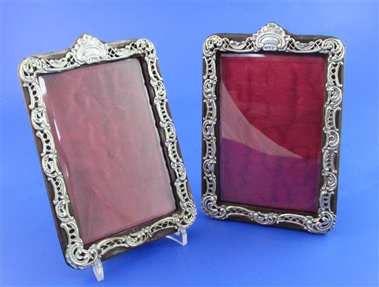 A pair of Edwardian silver mounted leather photograph frames, 7in.